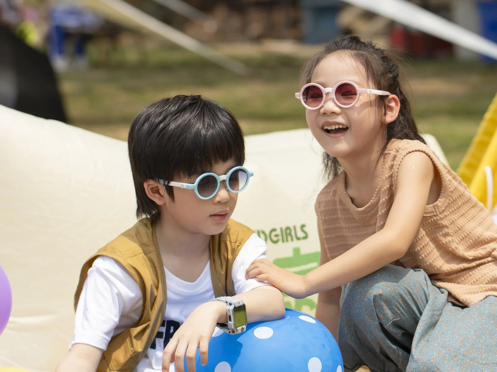 Two children outdoors wearing LIPO round sunglasses